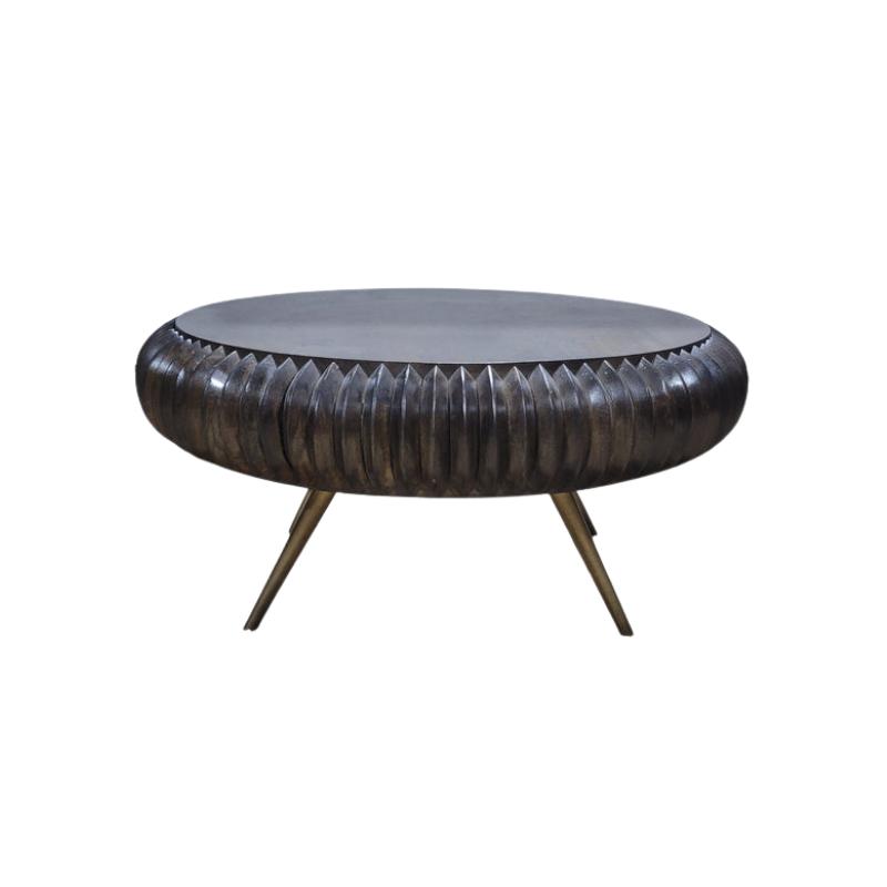 A round coffee table with a dark textured, ribbed metal body and three angled metal legs, shown against a plain white background.