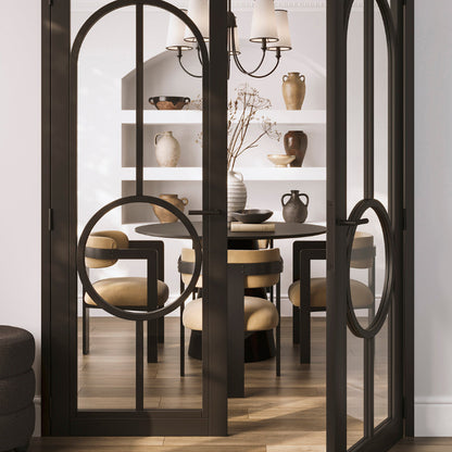 Dining room with a glass partition, table, chairs, and shelves with decorative items.