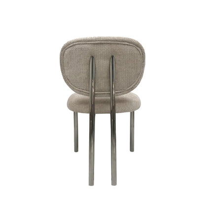 A modern dining chair with a textured light beige fabric upholstered seat and rounded backrest, supported by four slim polished chrome legs, shown from the rear against a solid white background.
