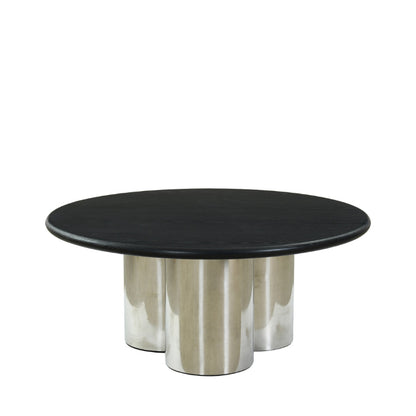 A modern round coffee table with a black wood top and three polished silver metal cylindrical legs, shown against a plain white background.