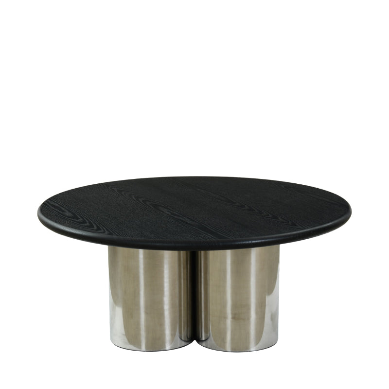 Round black marble table with metallic base on a white background