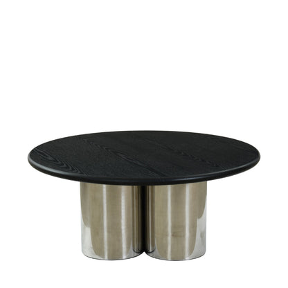 Round black marble table with metallic base on a white background