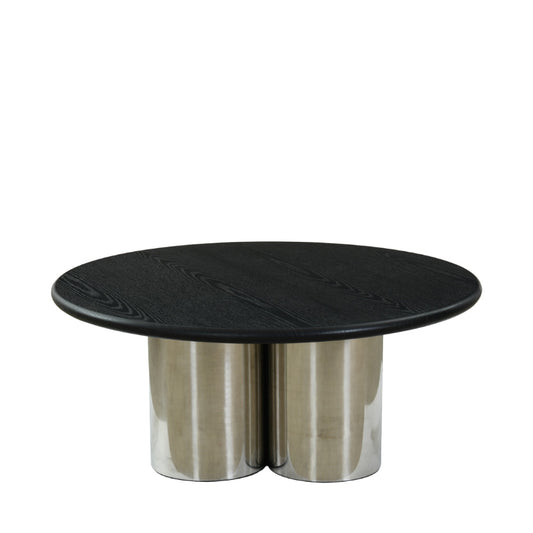 Round black marble table with metallic base on a white background