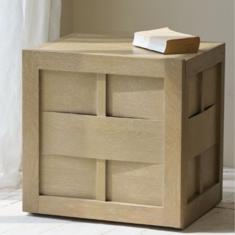 Wooden side table with geometric design and a book on top