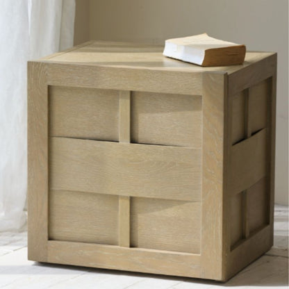Wooden side table with geometric design and a book on top