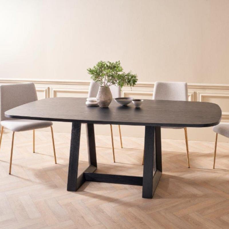 Dining table with chairs in a room with a neutral color scheme