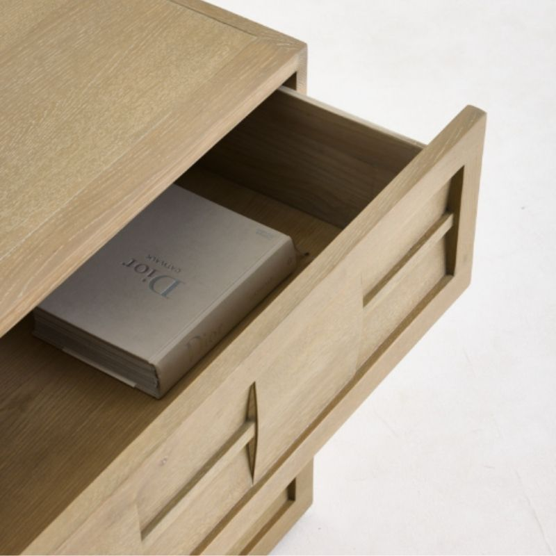 Wooden drawer with a Dior box inside on a white background