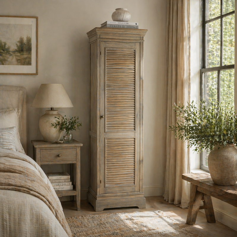 Nestled bedroom with wooden cabinet, lamp, and decor