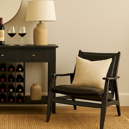 Wine rack with bottles, a chair with a pillow, and decorative items in a room setting.