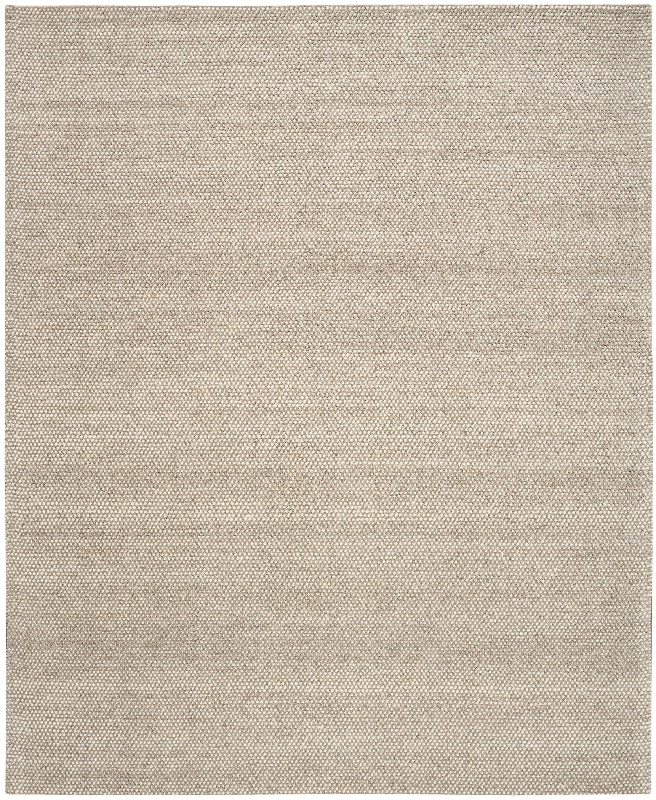 Beige area rug with a subtle pattern on a plain background