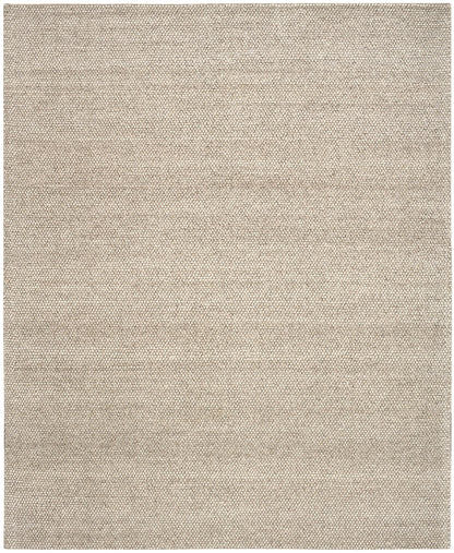 Beige area rug with a subtle pattern on a plain background