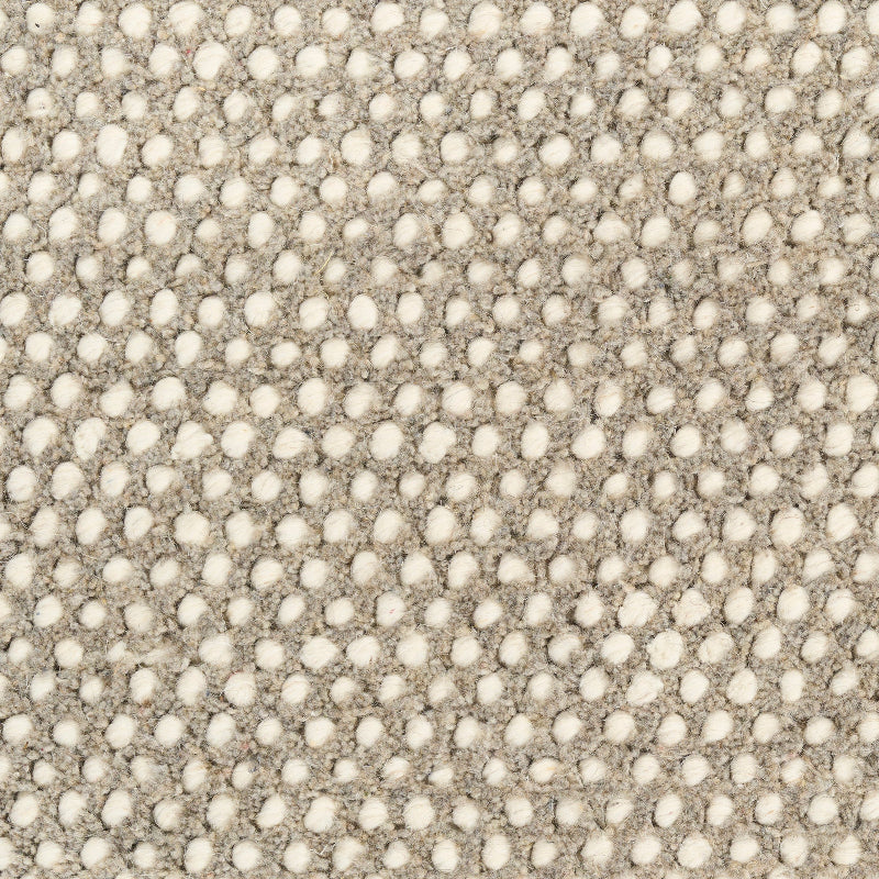 Textured fabric pattern with a subtle dot design.