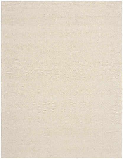 Beige area rug with a subtle pattern on a beige background