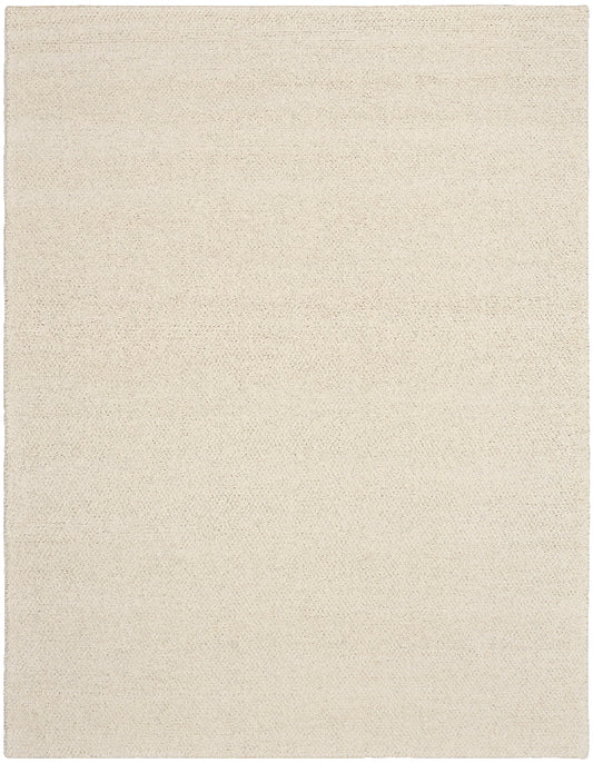 Beige area rug with a subtle pattern on a beige background