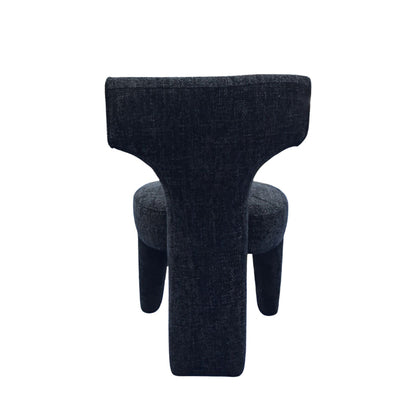 A modern sculptural T-shaped upholstered chair in a dark charcoal gray textured fabric, shown from the front on a plain white background.