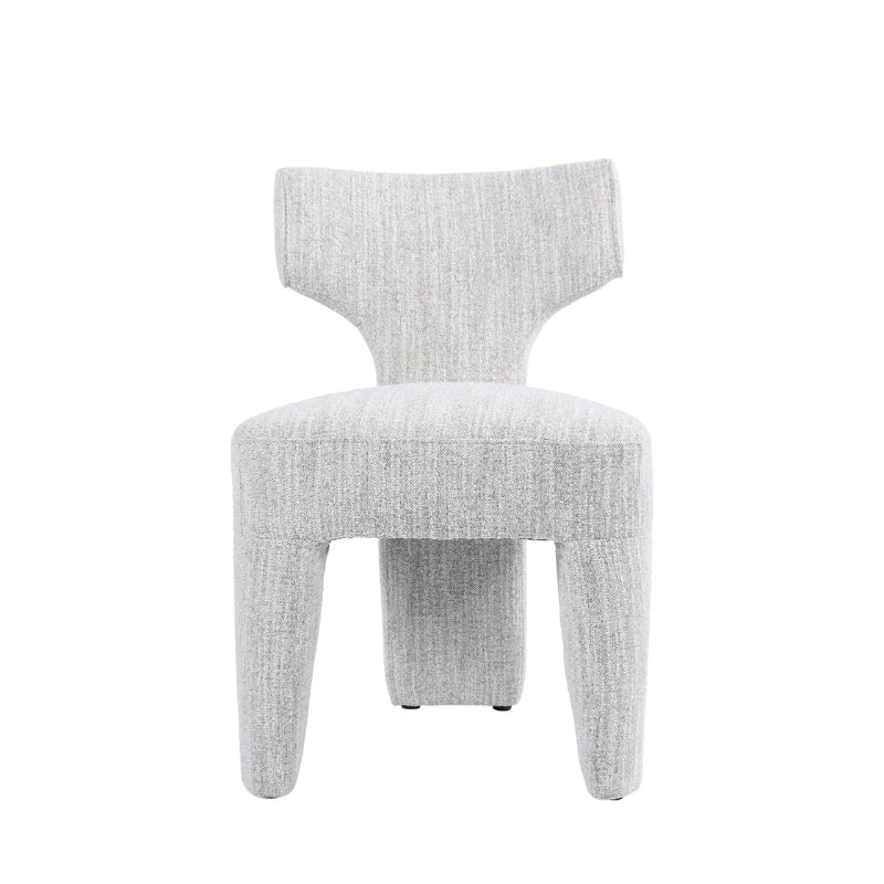 A modern upholstered accent chair with a textured light gray fabric, featuring a curved backrest and tapered legs, shown against a plain white background.