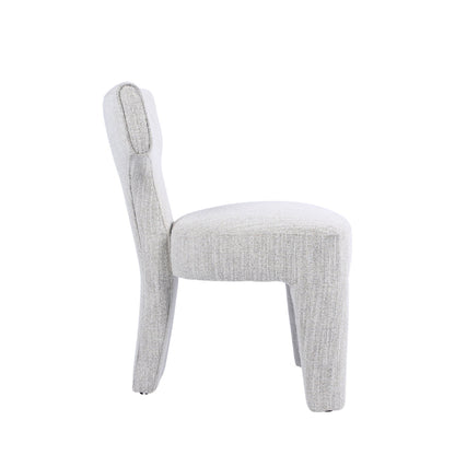 A light gray upholstered dining chair with a rounded backrest and tapered legs, shown from a side profile view against a solid white background.