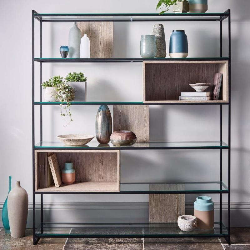 Modern shelving unit with decorative items against a neutral wall
