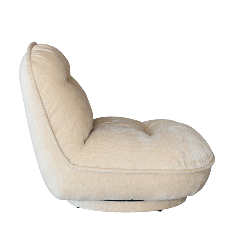 A modern low-profile swivel armchair upholstered in a textured cream or light beige fabric, shown from a side angle against a plain white background.