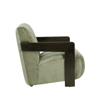 A modern accent chair featuring a dark brown wooden frame and a light sage green textured fabric upholstery, shown from a side profile on a white background.