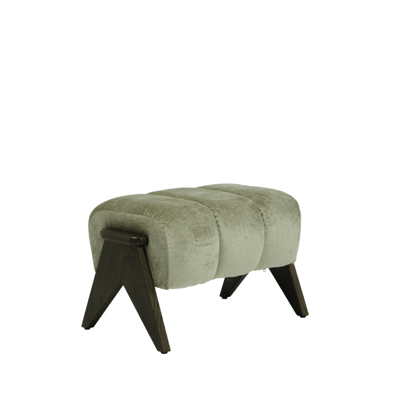A modern upholstered foot stool with a light sage green velvet cushion and dark brown angled wooden legs, shown on a plain white background.