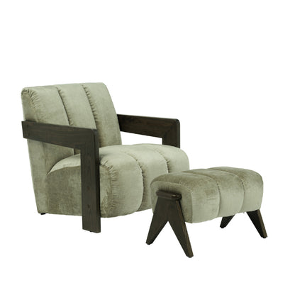 A modern armchair with a matching footstool, featuring light sage green velvet upholstery and dark brown wooden frame and legs, shown on a plain white background.