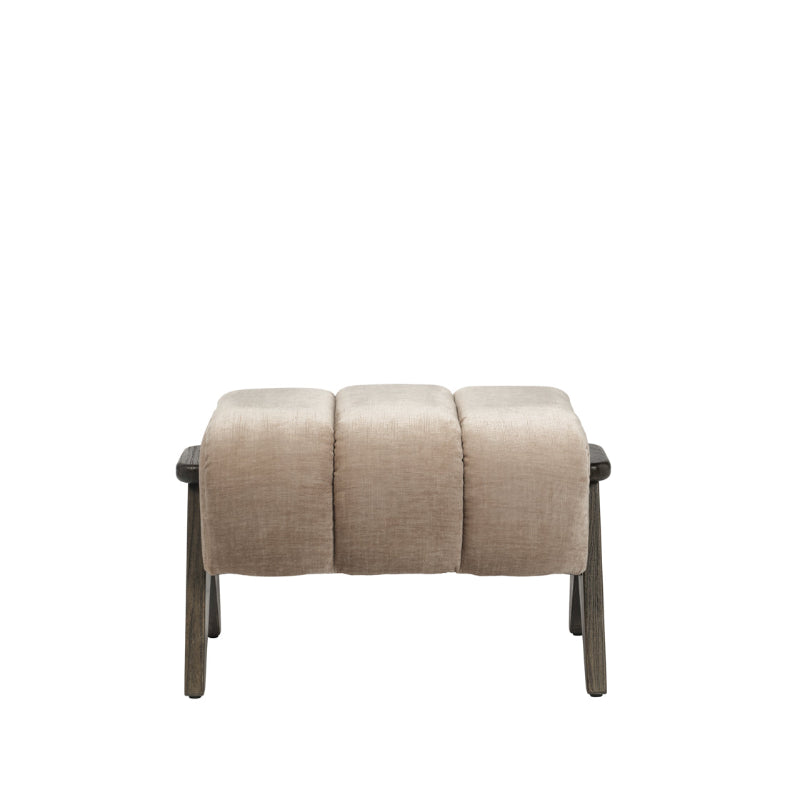 A modern three-seater upholstered foot stool with a textured beige fabric cushioned seat and dark wood legs, shown against a plain white background.