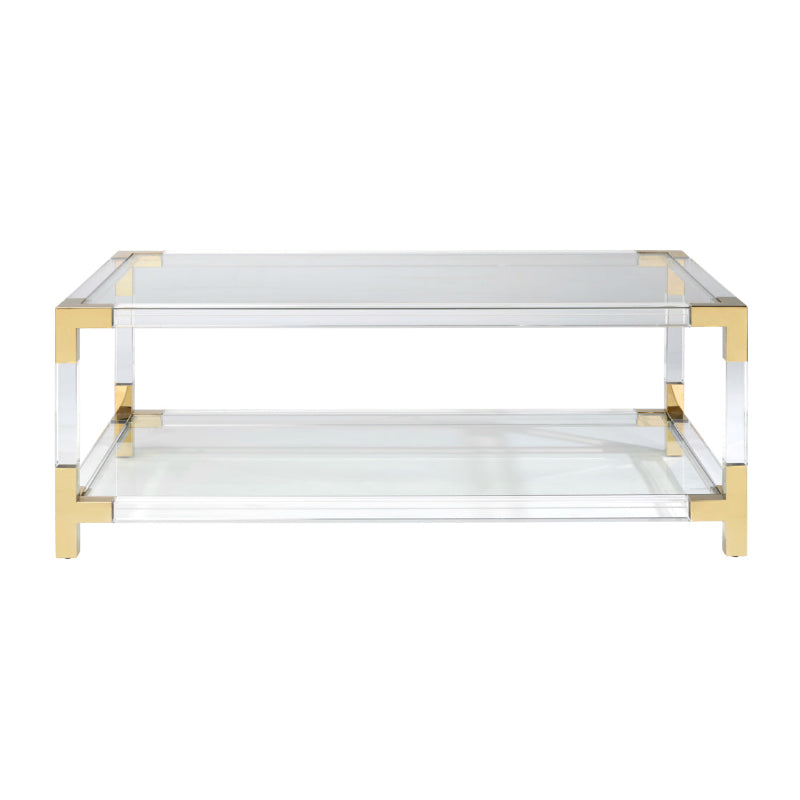 Acrylic coffee table with gold frame on a white background