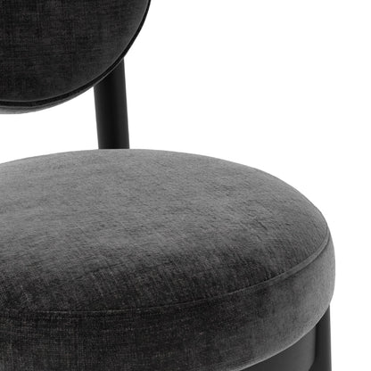 Gray upholstered chair with a black metal frame on a white background