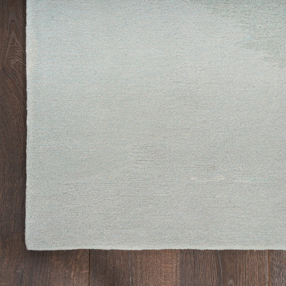 Gray rug on a wooden floor
