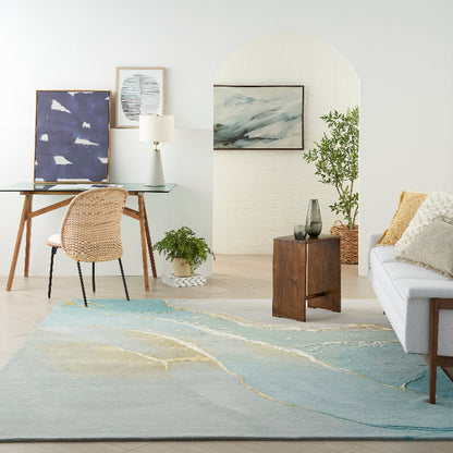 Modern living room with a large abstract rug, sofa, and decorative items.