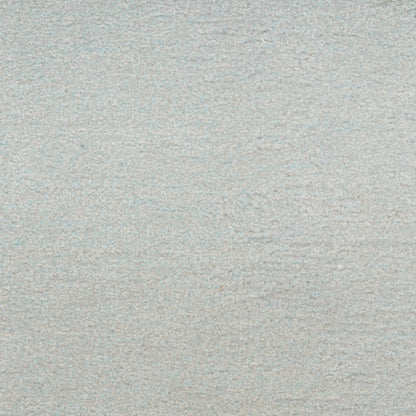 A close-up texture shot of a light gray, heathered fabric or material surface.