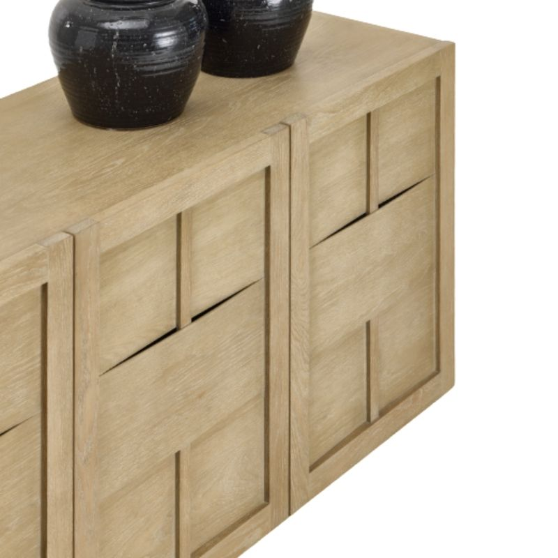 Wooden sideboard with black decorative items on a white background