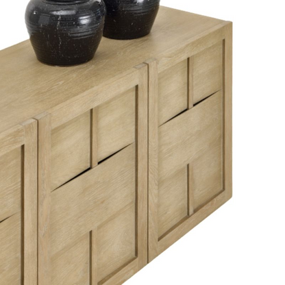 Wooden sideboard with black decorative items on a white background
