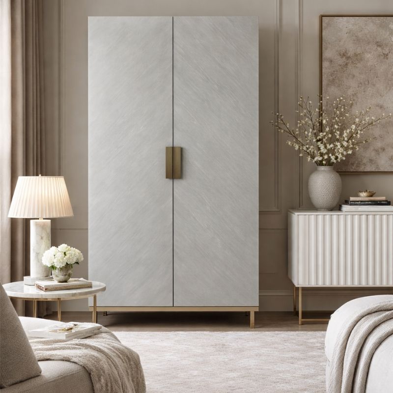 Modern bedroom with a large cabinet, lamp, and decorative items.