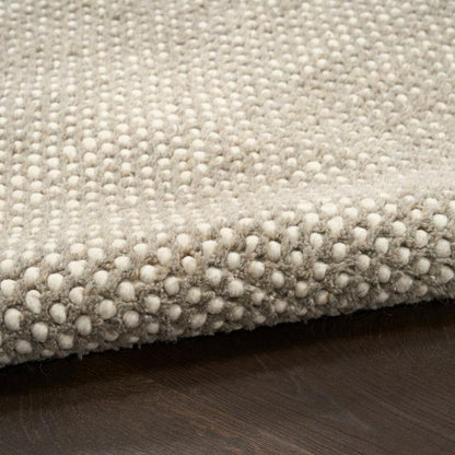 Close up of ivory grey rug