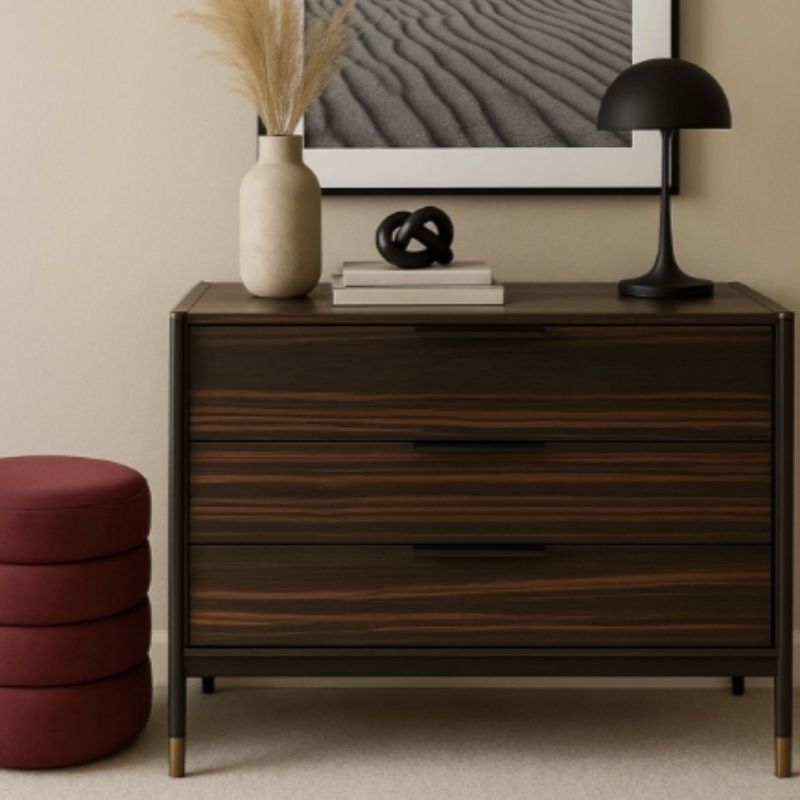 Wooden dresser with decorative items in a room setting