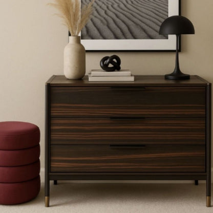Wooden dresser with decorative items in a room setting