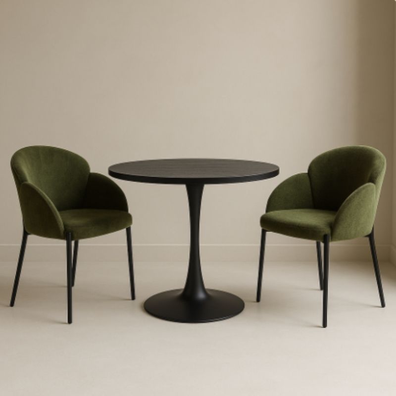 Round black table with two green chairs on a beige background