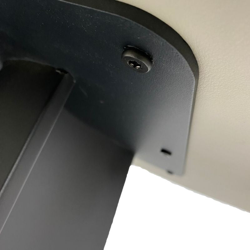 Close-up of a black metal bracket on a white background