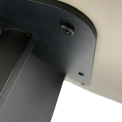 Close-up of a black metal bracket on a white background