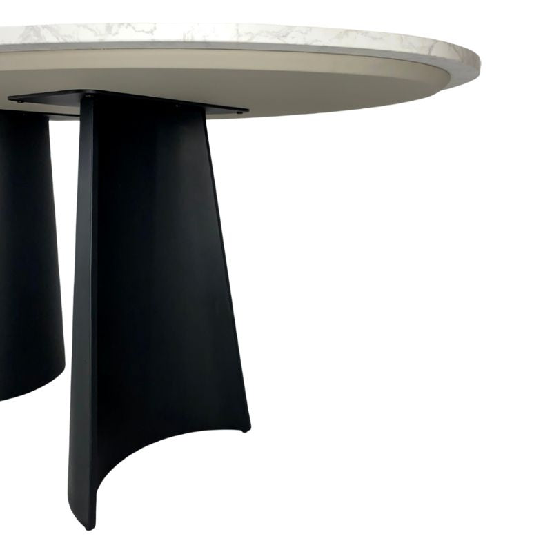 Oval table with a marble-like top and black curved legs on a white background