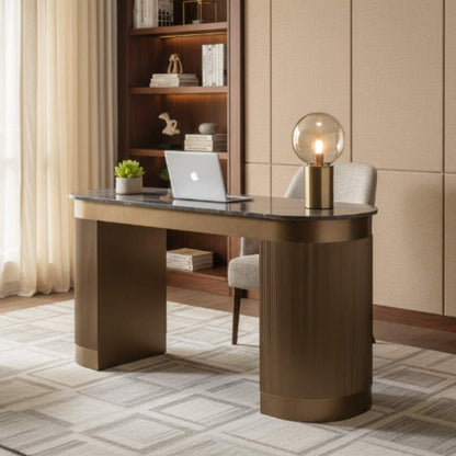 Modern home office with a wooden desk, laptop, and decorative items.
