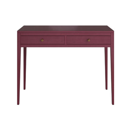 Fuchsia console table against a blue wall with decorative items