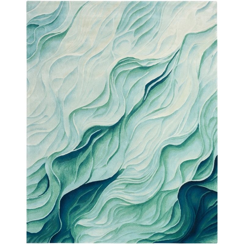 Abstractrug featuring layered, wavy organic patterns in shades of teal, mint green, and deep blue-green.