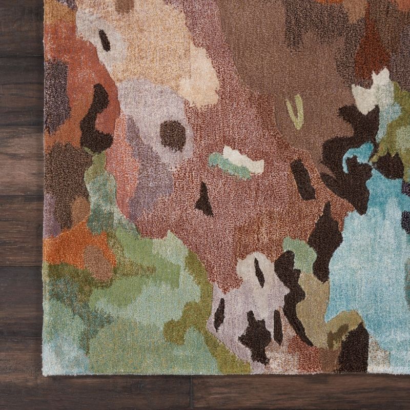 Multicolored abstract rug on a wooden floor