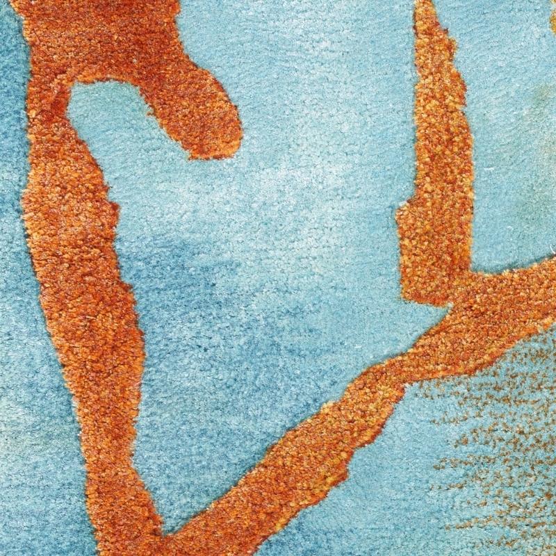 Close-up of a textured orange and blue surface