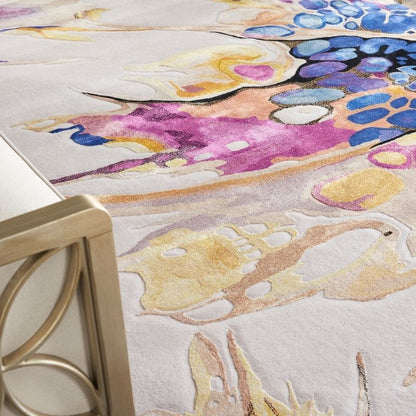 Colorful abstract rug with floral patterns on a light background