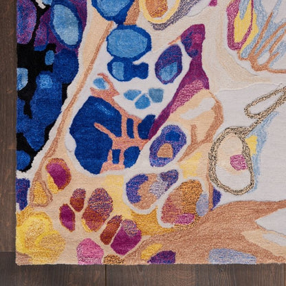 Colorful abstract patterned rug on a wooden floor
