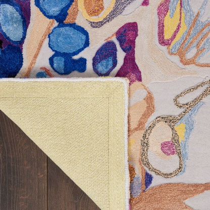 Close-up of a colorful floral-patterned rug with a textured border.